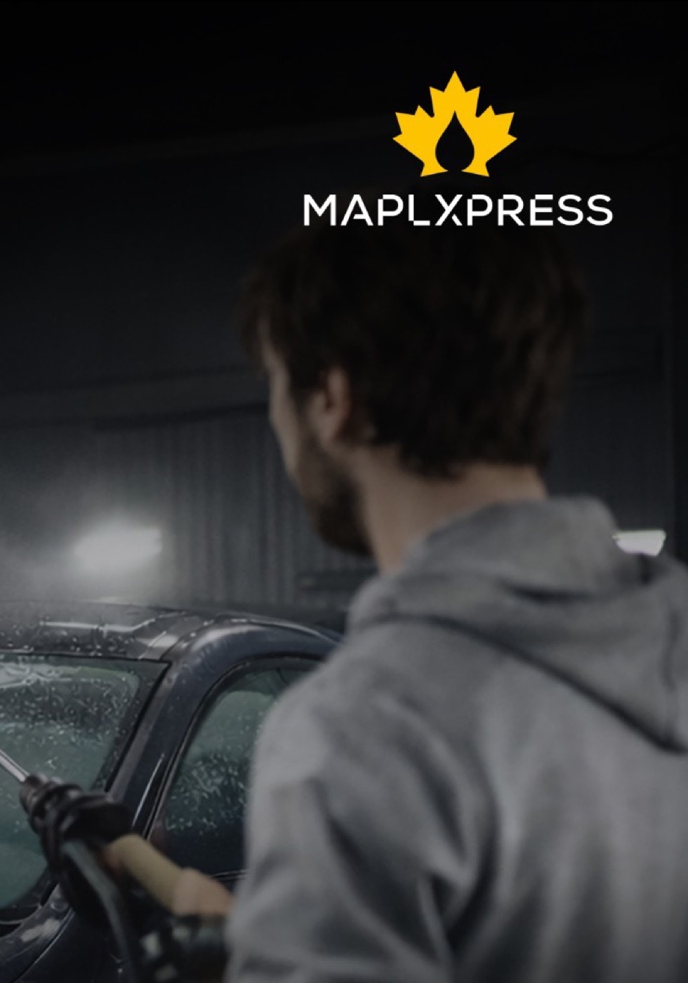 MaplXpress technician hand washing a car exterior in Mississauga