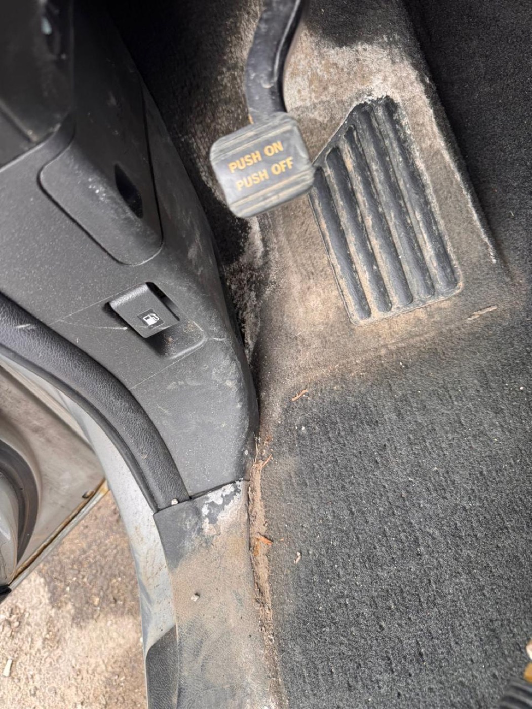 Dusty car pedal and carpet before, and vacuumed clean pedal area after interior detailing โ before